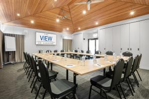 a large conference room with a long table and chairs at The View On Hannans Kalgoorlie in Kalgoorlie