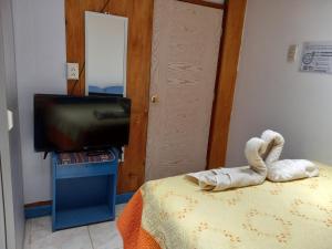 Postel nebo postele na pokoji v ubytování Posada Azul Cusco