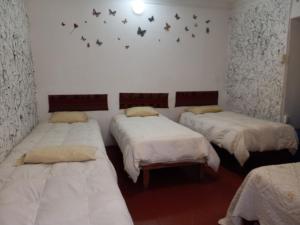 Postel nebo postele na pokoji v ubytování Posada Azul Cusco