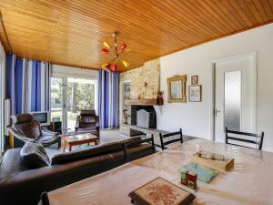 a living room with a couch and a table at Maison 6 pers, jardin clos, proche plages et commerces - FR-1-521-45 in Biscarrosse-Plage