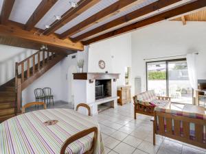 a living room with a table and a fireplace at Maison Biscarrosse Plage, 4 pièces, 8 personnes - FR-1-521-94 in Biscarrosse-Plage