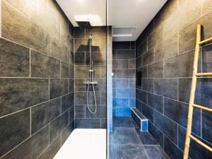 a bathroom with a shower with blue tiles at Maison de Charme 4 Chambres, 50m de la Mer, Centre des Sables d'Olonne - FR-1-197-508 in Les Sables-dʼOlonne
