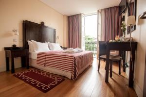 Uma cama ou camas num quarto em Hotel Bracara Augusta