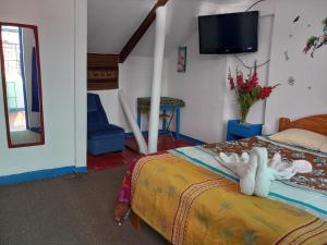 Postel nebo postele na pokoji v ubytování Posada Azul Cusco