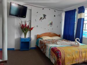 Postel nebo postele na pokoji v ubytování Posada Azul Cusco