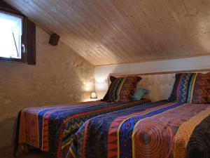 a bedroom with two beds in a attic at Charmante maison avec jardin privatif, proche des activités nature et des vignobles de Cognac - FR-1-653-221 in Saint-Sulpice-de-Cognac