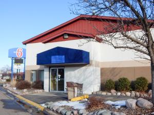 a gas station with a blue awning on the side at Motel 6-La Crosse, WI in La Crosse