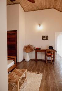 a living room with a desk and a table at Belamandy Lodge in Anjramarango