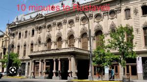 a large building with a sign on the side of it at Hotel type rooms on avenue Melikishvili, city center in Tbilisi City