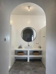 a bathroom with a sink and a mirror at Cabana in Gili Islands