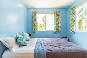 Ένα ή περισσότερα κρεβάτια σε δωμάτιο στο Brew Home Bacolod - 3 Bedroom House +20 φωτογραφίες