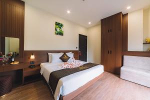 Postel nebo postele na pokoji v ubytování GREENECO DA LAT HOTEL - Khách sạn Green Eco Đà Lạt
