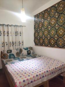 Postel nebo postele na pokoji v ubytování Purple Homestay Hillside