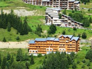 an aerial view of a hotel on a hill at Studio confortable avec balcon à 400m des pistes - Auris en Oisans - FR-1-297-138 in Auris +7 photos