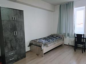 Postel nebo postele na pokoji v ubytování Nomad Inn