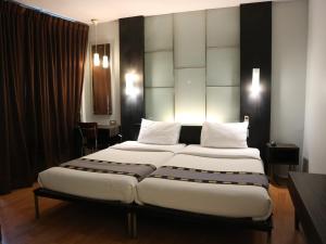 Postel nebo postele na pokoji v ubytování Swana Bangkok Hotel