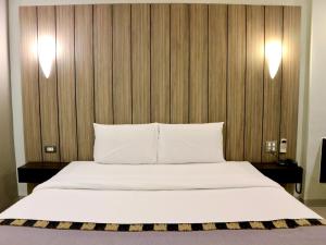 Postel nebo postele na pokoji v ubytování Swana Bangkok Hotel