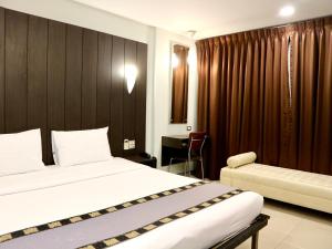 Postel nebo postele na pokoji v ubytování Swana Bangkok Hotel