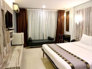 Postel nebo postele na pokoji v ubytování Swana Bangkok Hotel