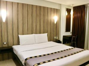 Postel nebo postele na pokoji v ubytování Swana Bangkok Hotel