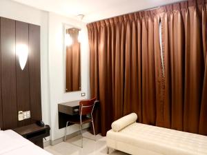 Postel nebo postele na pokoji v ubytování Swana Bangkok Hotel