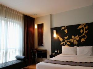 Postel nebo postele na pokoji v ubytování Swana Bangkok Hotel