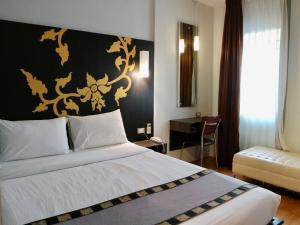 Postel nebo postele na pokoji v ubytování Swana Bangkok Hotel