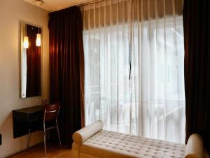 Postel nebo postele na pokoji v ubytování Swana Bangkok Hotel
