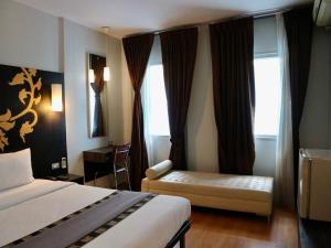 Postel nebo postele na pokoji v ubytování Swana Bangkok Hotel