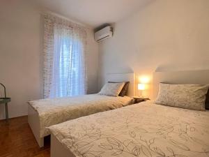 Posteľ alebo postele v izbe v ubytovaní Apartment Giordi
