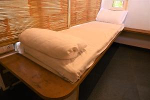 Postel nebo postele na pokoji v ubytování Amraness Luxury Resort Sasan Gir