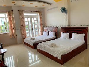 Postel nebo postele na pokoji v ubytování Ngoc May Guesthouse + 34 fotografií
