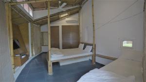 Postel nebo postele na pokoji v ubytování Amraness Luxury Resort Sasan Gir