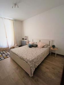 a bedroom with a large bed with pillows on it at Ceci's home - Few steps from Monaco WITH PARKING in Beausoleil