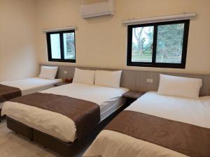 Llit o llits en una habitació de Meinong Yun Shanju Homestay