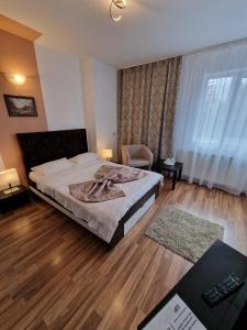 Postel nebo postele na pokoji v ubytování Hotel Marasesti