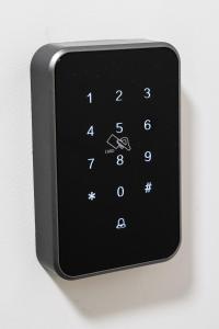 a close up of a remote control with numbers on it at Magnetic apartment Nowogrodzka B in Warsaw