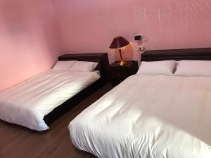 Una cama o camas en una habitación de XingYe B&B