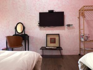 Una cama o camas en una habitación de XingYe B&B