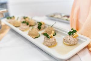 a plate of appetizers on a counter in a store at Hotel Lovran in Lovran