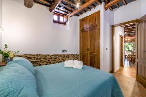 Postel nebo postele na pokoji v ubytování Casa Antonia Capileira La Alpujarra
