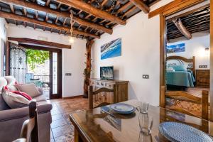 TV a/nebo společenská místnost v ubytování Casa Antonia Capileira La Alpujarra