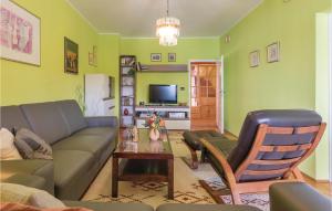 a living room with a couch and a table at Beautiful Apartment In Pula With 2 Bedrooms And Wifi in Pula