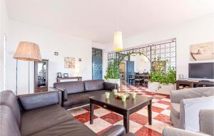 a living room with couches and a coffee table at Urb Panorama in Taramay