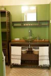 a bathroom with a sink and a mirror at Résidence Ogliastrello in Olmeto