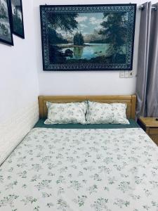 Postel nebo postele na pokoji v ubytování Friendly House Homestay