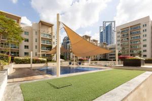 a sculpture of a boat in a courtyard at Bright & Relaxing 1BR Apartment in Dubai