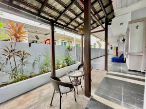 an open office with plants on the walls at Comfort 36 Entire House At Alma Bukit Mertajam in Bukit Mertajam