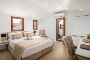 Postel nebo postele na pokoji v ubytování Le Premier Luxury Rooms