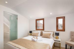 Postel nebo postele na pokoji v ubytování Le Premier Luxury Rooms